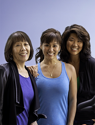 Kelly, middle, with her mom and sister, all three are breast cancer survivors